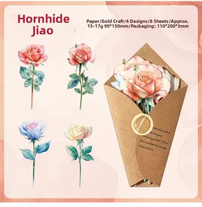 Detailed close-up of watercolor rose gold foil stickers with floral bookmarks for DIY scrapbooking