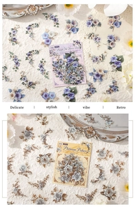 Detail of vintage floral stickers showing purple petals and rose textures on rustic fabric