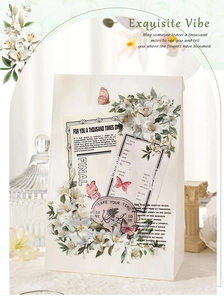 Detailed view of vintage lily floral stickers on elegant paper gift bag material