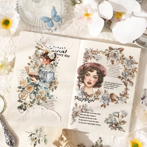 Vintage scrapbooking stickers with portraits and flowers on a notebook layout