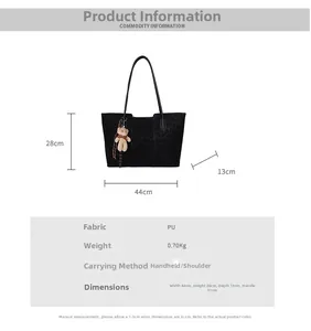 Detail view of large leopard print tote bag with dimensions and cute bear pendant charm