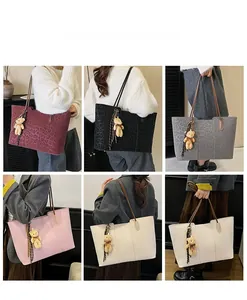 Detailed grid showing leopard embossed tote bags in six colors with bear charms