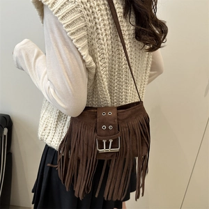 Bohemian brown matte leather shoulder bag with long fringes and metal buckle detail