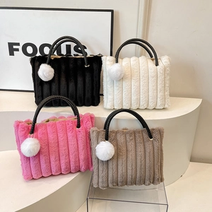 Plush faux fur tote bag with vertical stripes and black woven handles in four colors