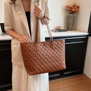 Brown quilted tote bag with gold studs and large capacity for women's daily commute