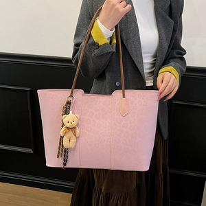 Pink leopard print large tote bag with brown straps and cute bear pendant accessory
