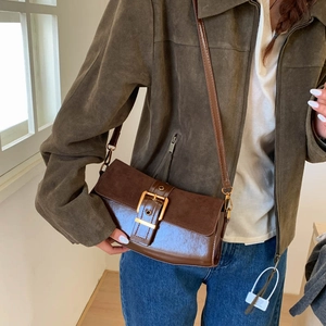Brown leather and suede patchwork shoulder bag with elegant golden buckle detail