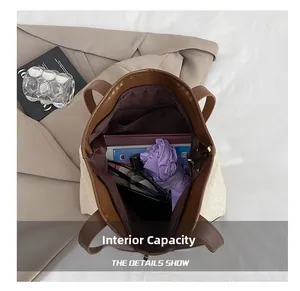 Detailed interior view showing large storage capacity and zipper pocket of the tote bag