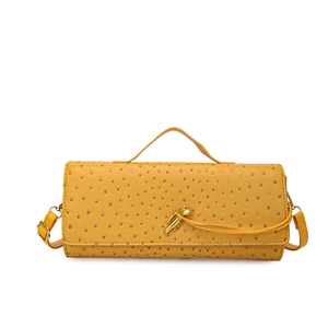 Yellow ostrich texture baguette handbag with top handle and golden twist lock closure