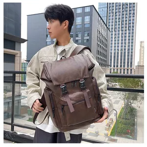 Detail view of vintage brown PU leather backpack with buckle straps and side pockets