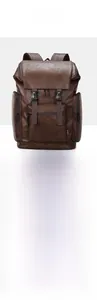 Detailed macro view of dark brown faux leather texture and buckle on a men's backpack