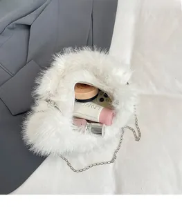 Detailed interior view of white faux fur bag showing phone and cosmetic storage capacity