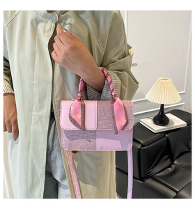 Pink patchwork crossbody bag with glitter panels and silk scarf detail on handle