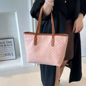 Pink tote bag with brown leather straps and all-over M letter print for daily commute