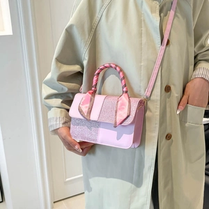 Chic pink patchwork crossbody bag with sequin detail and silk scarf handle decor