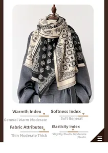 Detail of paisley pattern and soft tassel edges on a thick warm black and white scarf