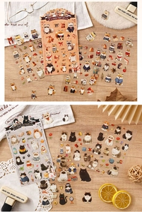 Detailansicht niedlicher Fuchs- und Katzensticker für DIY-Planer auf einem Holztisch