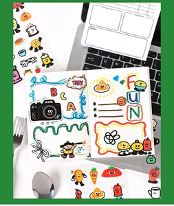 Macro detail of cute cartoon PET stickers on a notebook with creative hand-drawn patterns