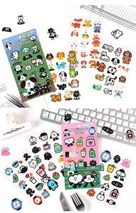 Close-up of cute cartoon PET stickers including cats and dogs for journal decoration