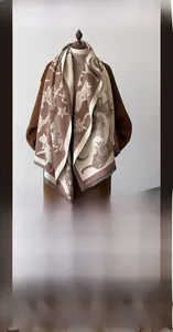 Close-up of winter scarf made of imitation cashmere with artistic cat and moon patterns
