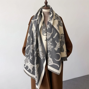Deep grey and cream shawl with cartoon cat, moon and star patterns and fine fringe