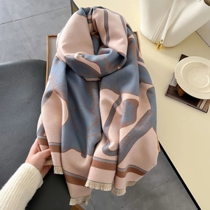 Elegant thick warm winter scarf with pink and blue floral patterns and tassel edges