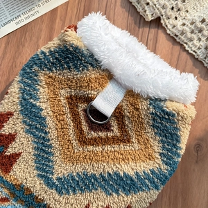Close-up of Fair Isle pet vest with warm Sherpa lining and metal D-ring attachment