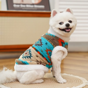 Detail of bohemian pattern pet fleece vest with plush faux fur trim on a Pomeranian
