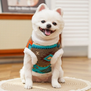 Close-up of brown pet fleece vest with ethnic patterns and white faux fur edges