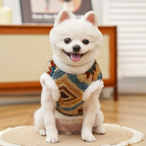 Detail view of ethnic geometric pattern and plush lining on a warm pet fleece vest
