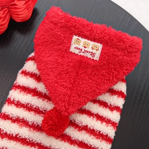 Macro detail of red striped pet hoodie featuring soft fleece texture and cute bear patch