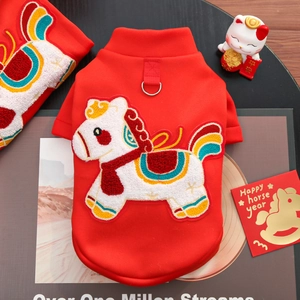 Detail of red pet New Year vest with zodiac horse embroidery and metal D-ring attachment