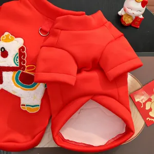 Detail of red pet hoodie with horse embroidery and metal D-ring for leash attachment