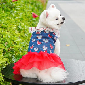 Detail of denim dog dress with heart patterns and red mesh tutu for small dogs