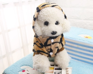 Detailed view of striped tiger print pet hoodie with soft plush fabric and white buttons