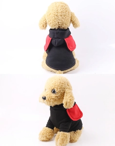 Detail of pet hoodie featuring red decorative wings and ribbed cuffs on black knit fabric