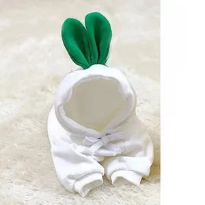Detail of white fleece pet hoodie featuring green 3D carrot leaf design on the hood