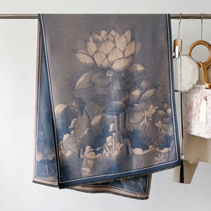 Detail of elegant lotus print shawl with fringe edges and grey-blue floral pattern