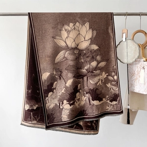 Detail of elegant lotus print shawl with fringe edges on a classic sepia scarf