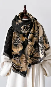 Detail of vintage floral pattern and fine fringe on a warm winter cashmere shawl