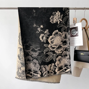 Close-up of double-sided jacquard scarf with floral peony pattern and fringe details