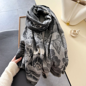 Elegant vintage floral print scarf with tassels for winter, displayed on a chair