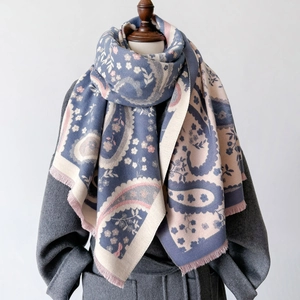 Elegant paisley floral winter shawl wrap for women with tassel edges on grey wool coat