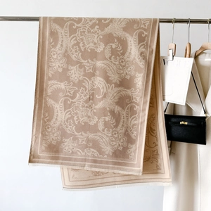 Elegant vintage floral scarf in light brown knit with soft fringe and retro pattern