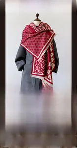 Close-up of premium red and white plaid scarf with jacquard texture and fringed edges