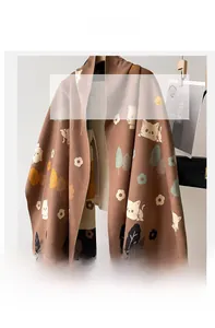 Detailed texture of imitation cashmere scarf featuring cute cartoon cat and floral patterns