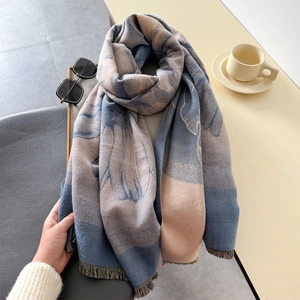 Classic blue cashmere-like scarf with abstract floral prints and fringe details