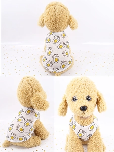 Detail view of a white breathable dog t-shirt with cartoon egg print on a poodle