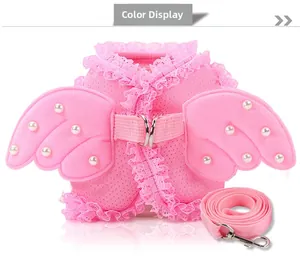 Detailed view of pink mesh pet harness with lace edges, angel wings and pearl accents