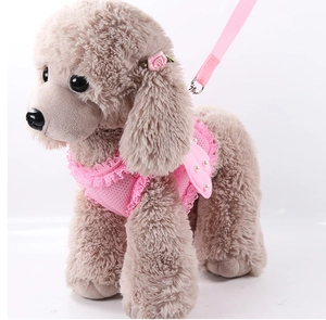 Detailed view of pink mesh pet harness with lace ruffles, angel wings and white pearls